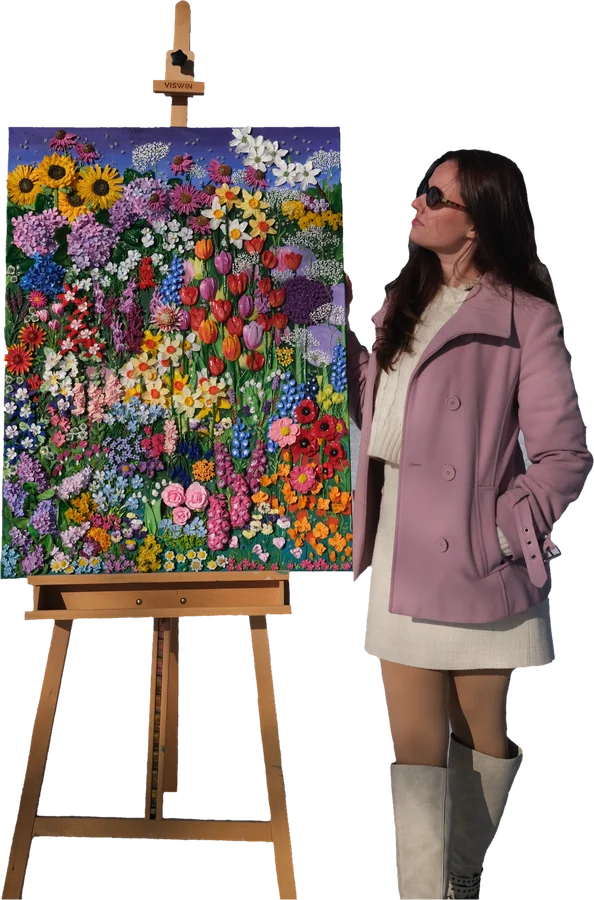 Paulina beside a tall canvas of sculpted wildflowers on an easel.
